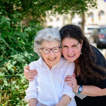 Mom and daughter smiling 1