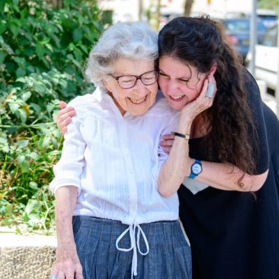 Mother and daughter laughing