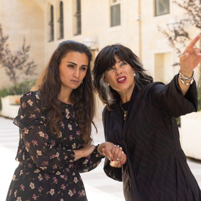 Women pointing and looking far away