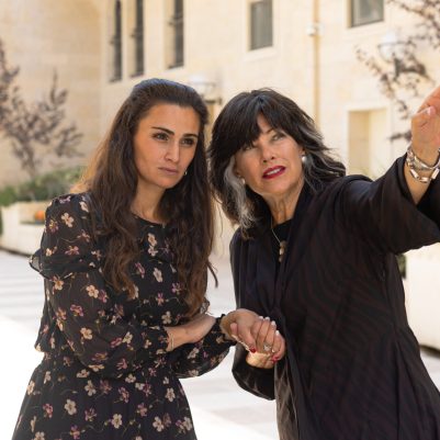 Women pointing and looking far away 2