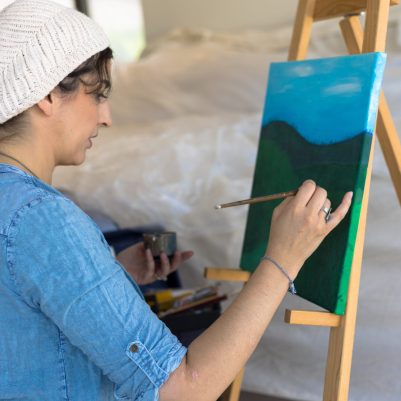 Artist painting on canvas