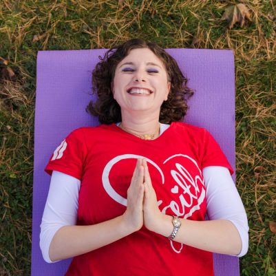 Smiling woman practicing yoga