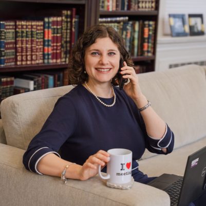 Woman talking on phone and working on laptop 3