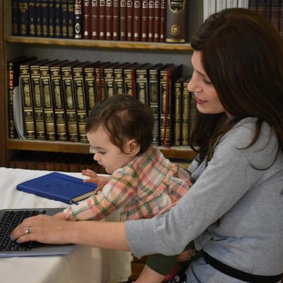 Mother and baby looking at computer