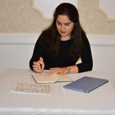 Woman writing in notebook
