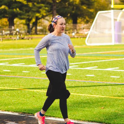 Woman running on track 1
