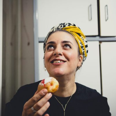 Woman eating sufganiyah 1