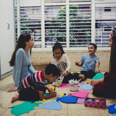 Family making Chanukah arts and crafts