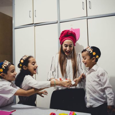 Mother giving kids sufganiyot 2