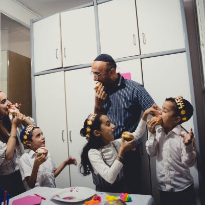 Family eating sufganiyot