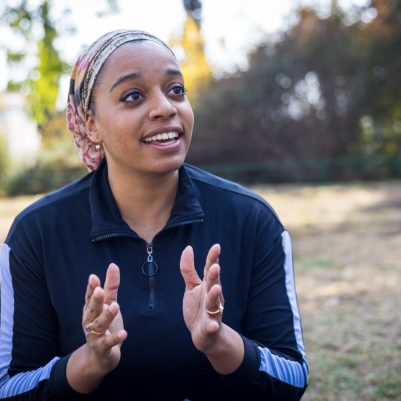 Woman speaking and gesturing with hands 1