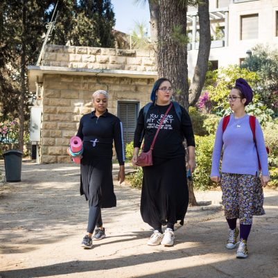 Three women walking in park