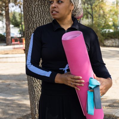 Woman holding yoga mat 2