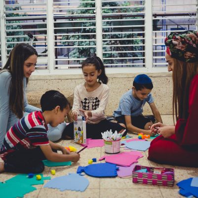 Family making Chanukah arts and crafts 1