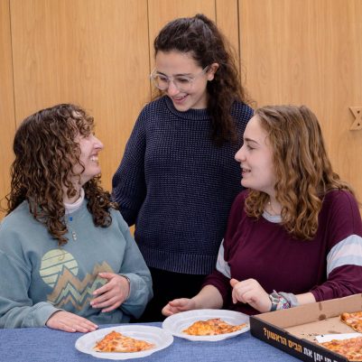 Group of young women eating pizza 2