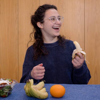 Young woman eating fruit 2
