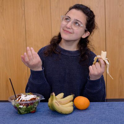 Young woman eating fruit 3