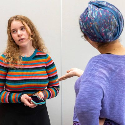 Woman reprimanding teenager about phone 1