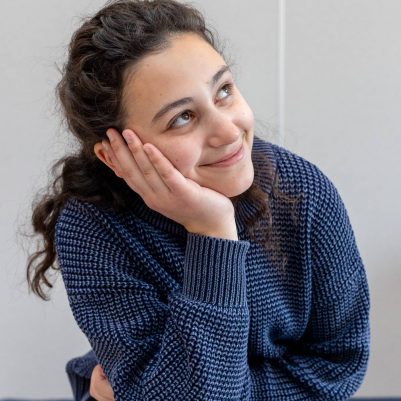 Young woman thinking and looking to the side