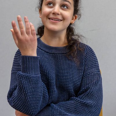 Young woman smiling and looking up