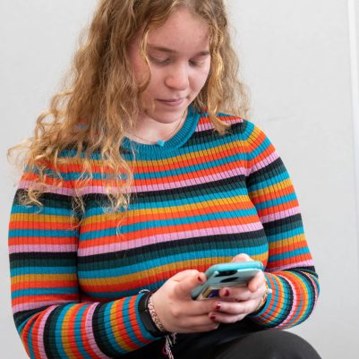Young woman looking at phone 1