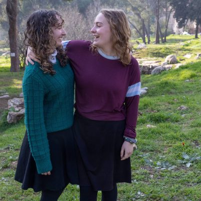 Two young women standing side by side 2