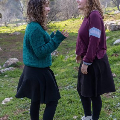 Two young women in conversation outside 1