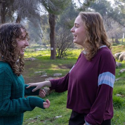 Two young women in conversation outside 2
