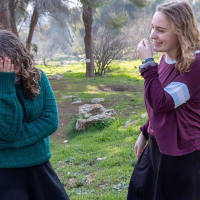 Two young women laughing outside 1