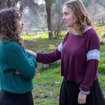 Young woman comforting friend 2