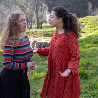 Two young women arguing outside 1