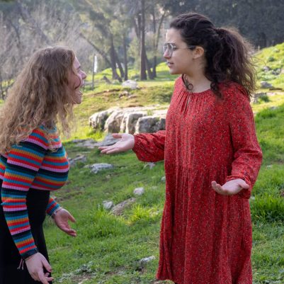 Two young women arguing outside 2
