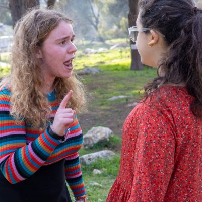 Two young women arguing outside 6
