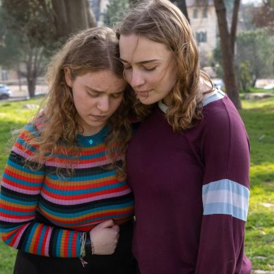 Young woman hugging crying friend 2