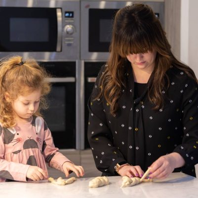 Mother and daughter making challah 3