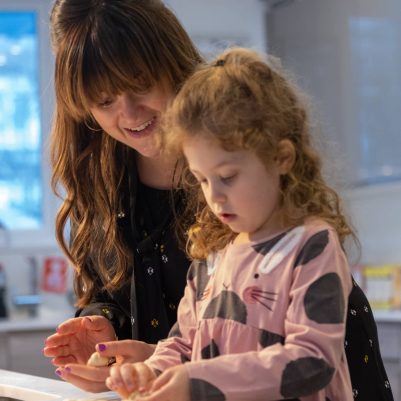 Mother and daughter making challah 7