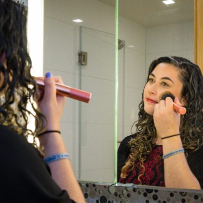 Woman putting on blush 2