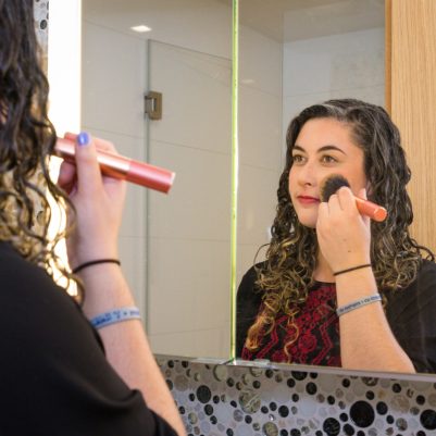 Woman putting on blush 1