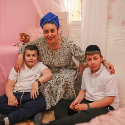 Mother smiling with two sons