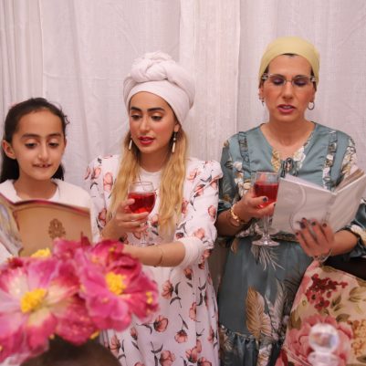Women singing at Seder table