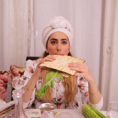 Woman eating Korech sandwich at Seder 2