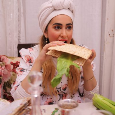 Woman eating Korech sandwich at Seder 1