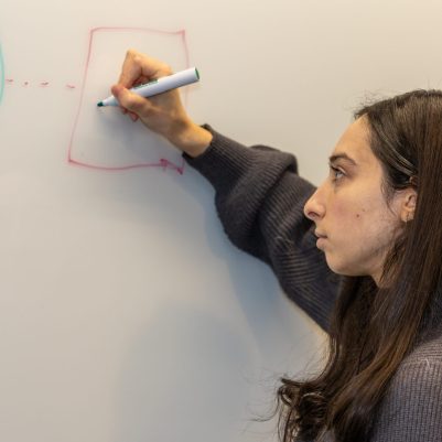 Woman drawing on whiteboard 2