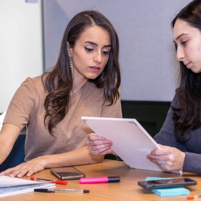 Businesswomen discussing document 1