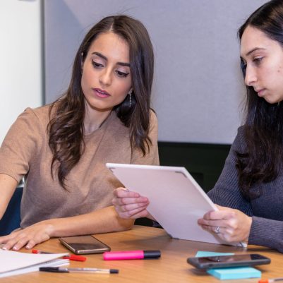 Businesswomen discussing document 2