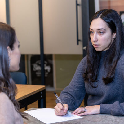 Businesswoman taking notes at meeting 4