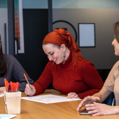 Laughing businesswomen at meeting 2