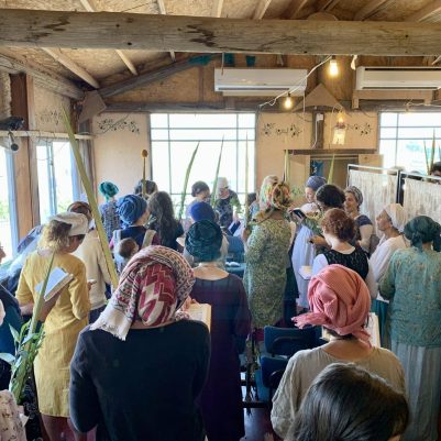 Women shaking Lulav and Esrog during prayer
