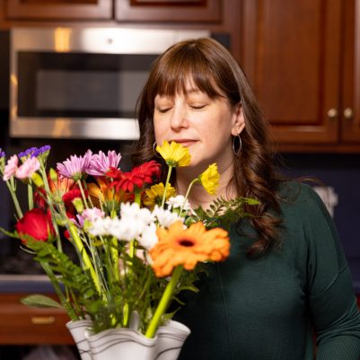 Woman smelling flowers