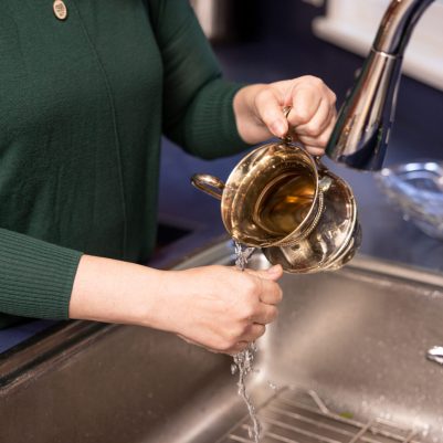 Woman using washing cup